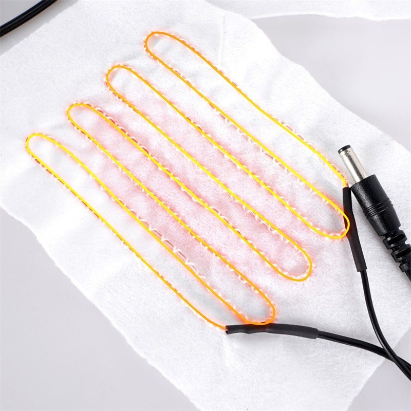 flexible carbon fiber heating element sewn into fabric for heated apparel such as heated gloves jackets and heated clothing