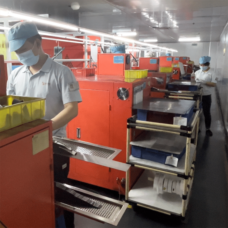 factory workers operating lithium battery pack production line OEM heated gloves heated apparel battery manufacturing mass production workshop