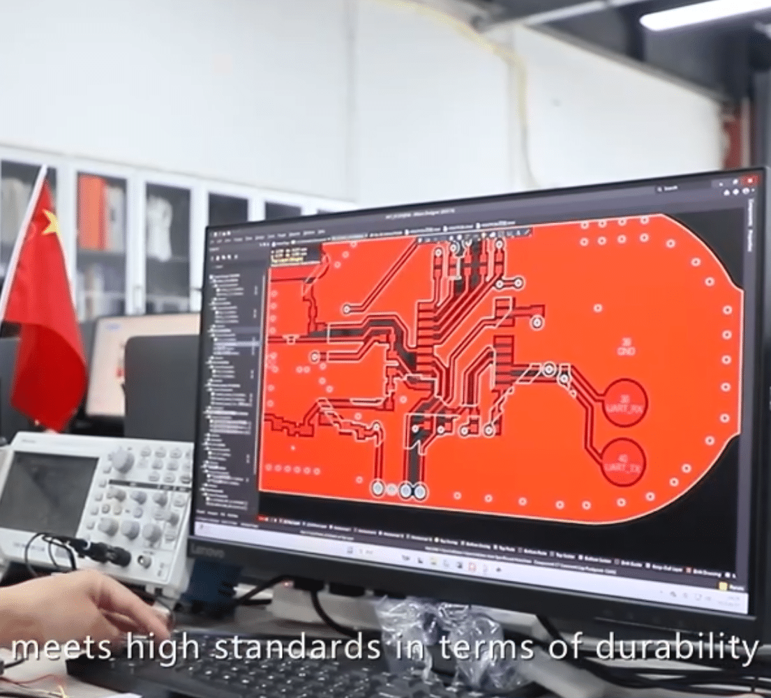 engineer designing PCBA circuit layout for heated apparel electronics and temperature control systems during in-house PCBA development